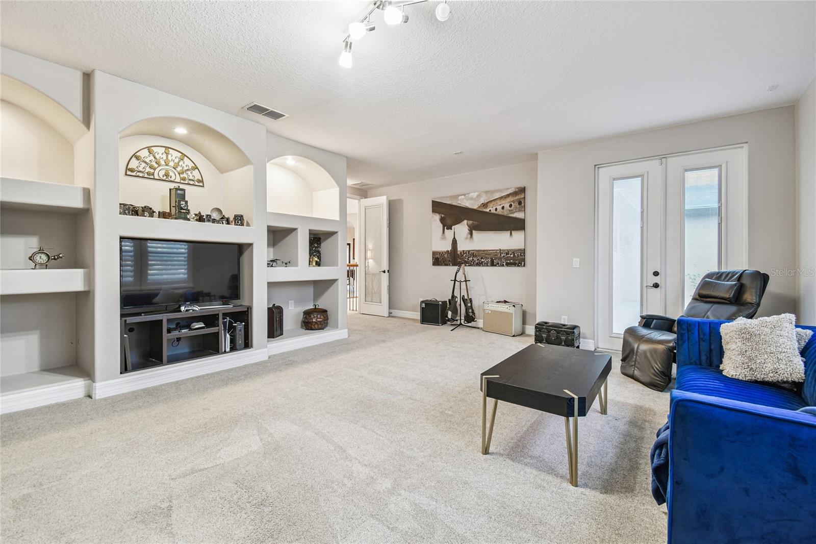 Upper level family/media room with access to balcony.