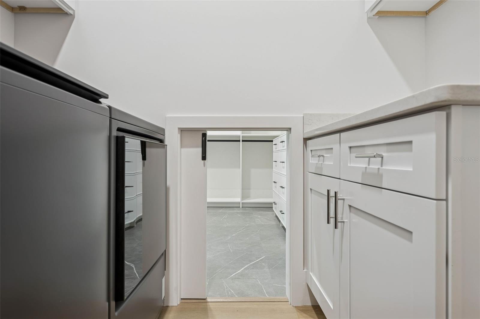 Laundry Basket Door to Primary Closet