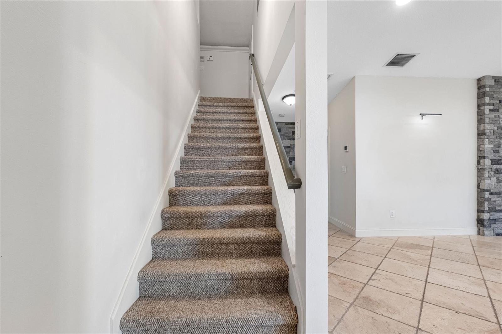 Main home stairs to bonus room/office/play area/4th bedroom