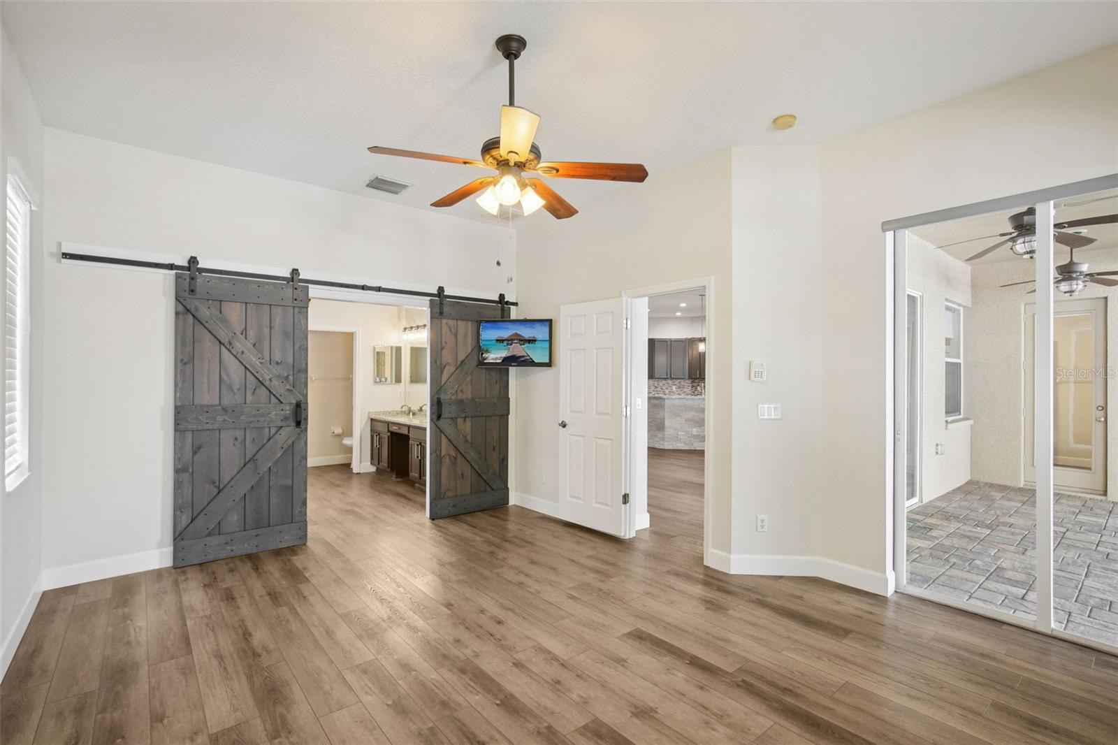 PRIMARY BEDROOM WITH CUSTOM BARN DOORS