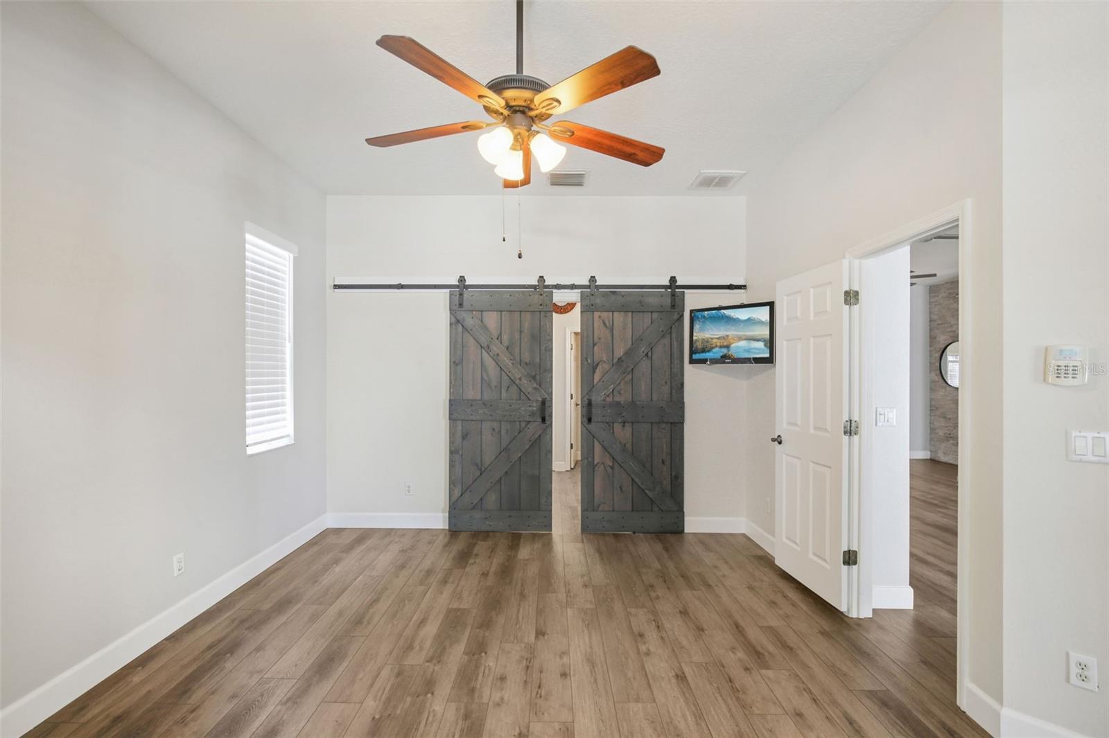PRIMARY BEDROOM WITH CUSTOM BARN DOORS