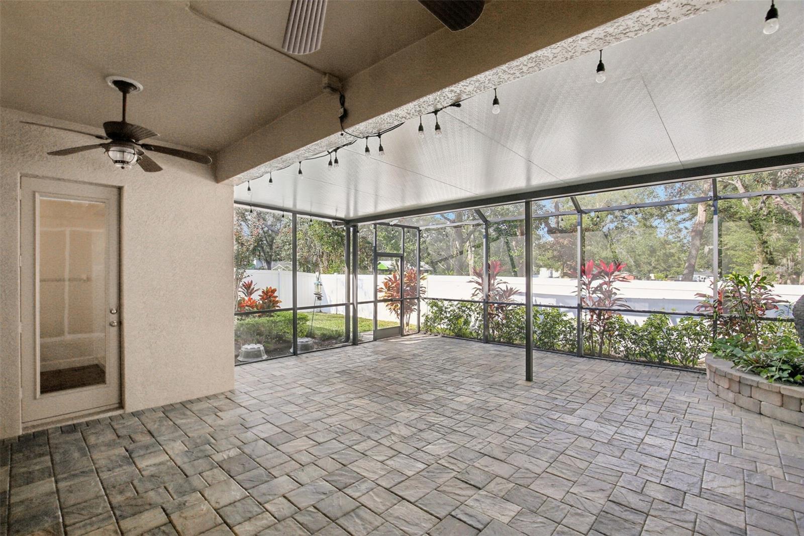 EXTENDED COVERED AND SCREEN LANAI WITH WATER FEATURE