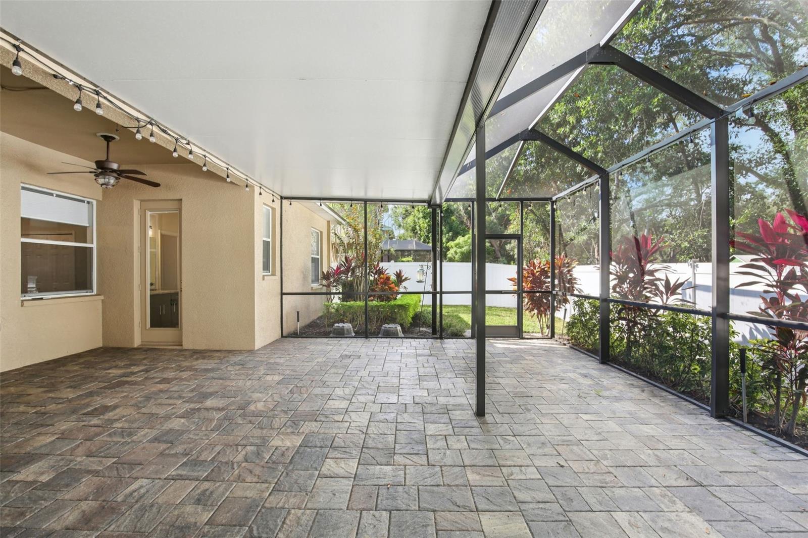 EXTENDED COVERED AND SCREEN LANAI WITH WATER FEATURE