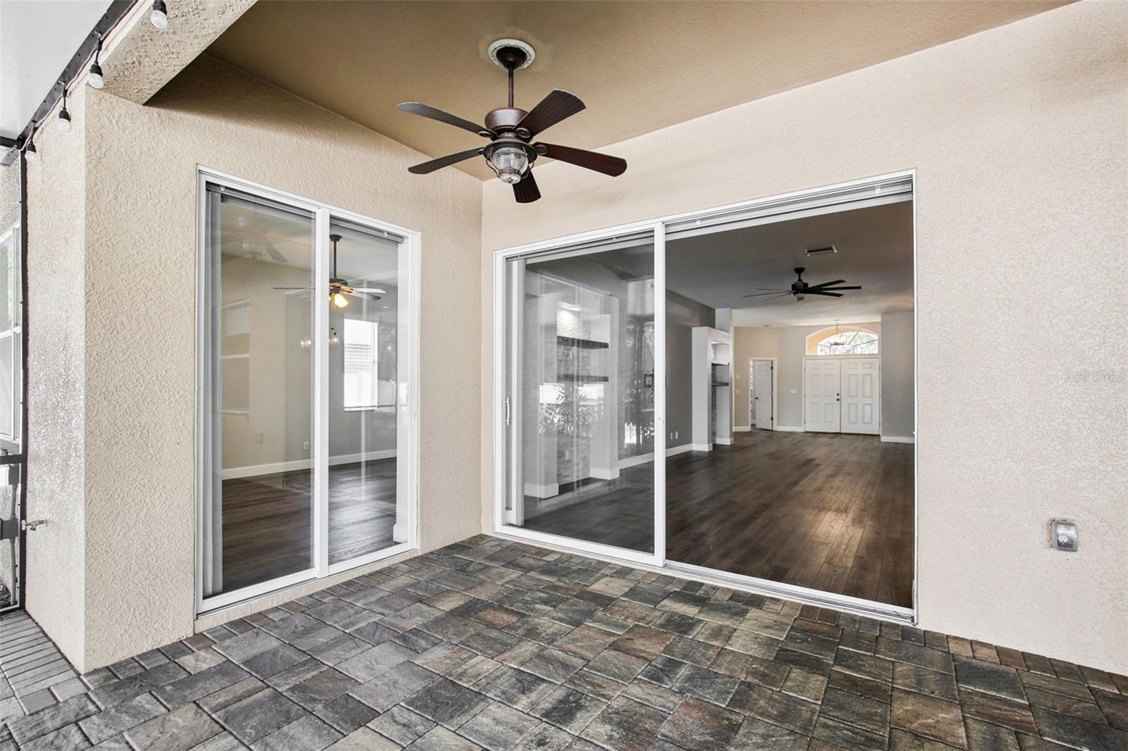 EXTENDED COVERED AND SCREEN LANAI WITH WATER FEATURE