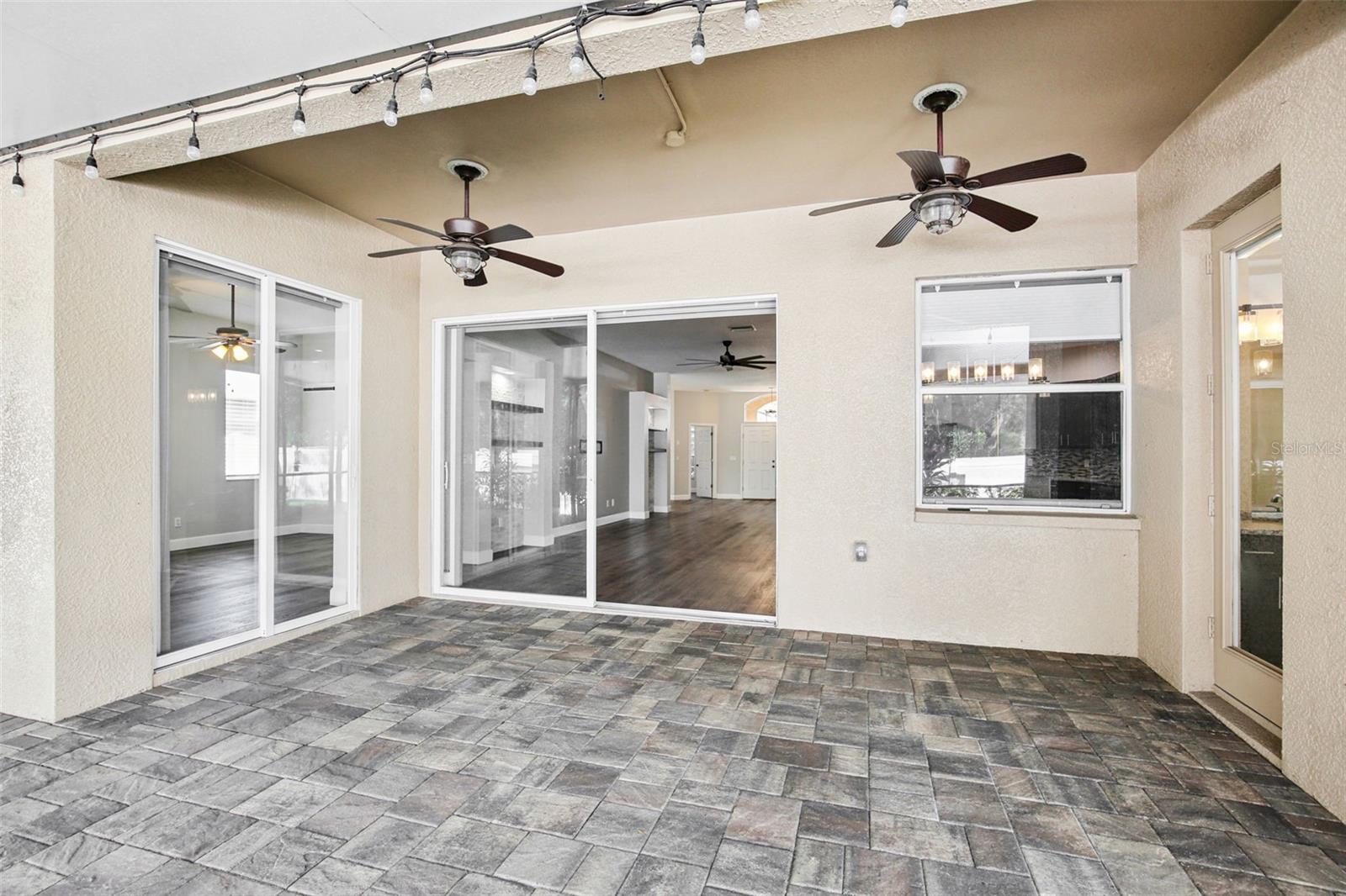 EXTENDED COVERED AND SCREEN LANAI WITH WATER FEATURE
