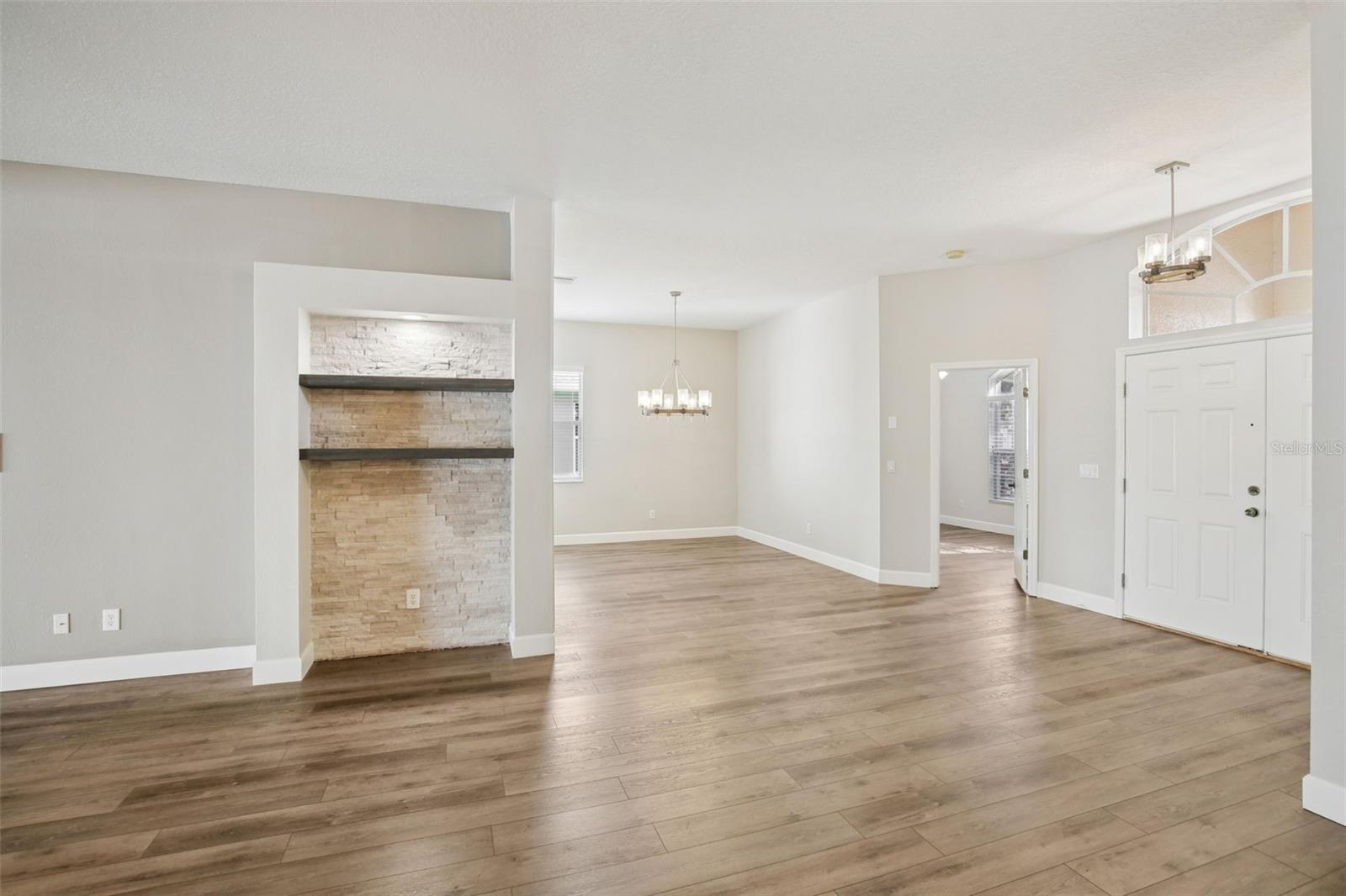 LARGE FAMILY ROOM WITH CUSTOM STONE WALL ACCENTS