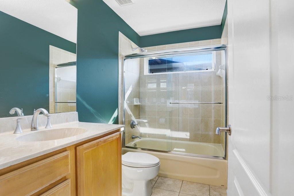 Secondary Bathroom Shared by Two Bedrooms off Kitchen and Family Room
