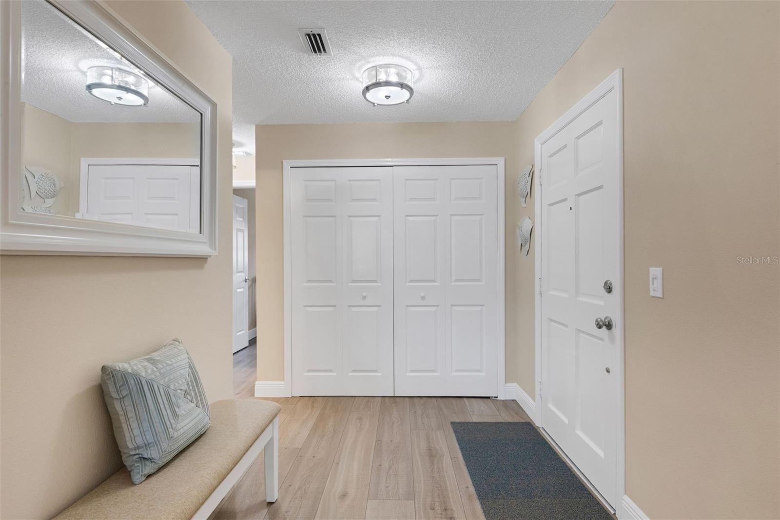 Front Door Entryway With large Closet.  The Hall Bath and Bedrooms are to the Left