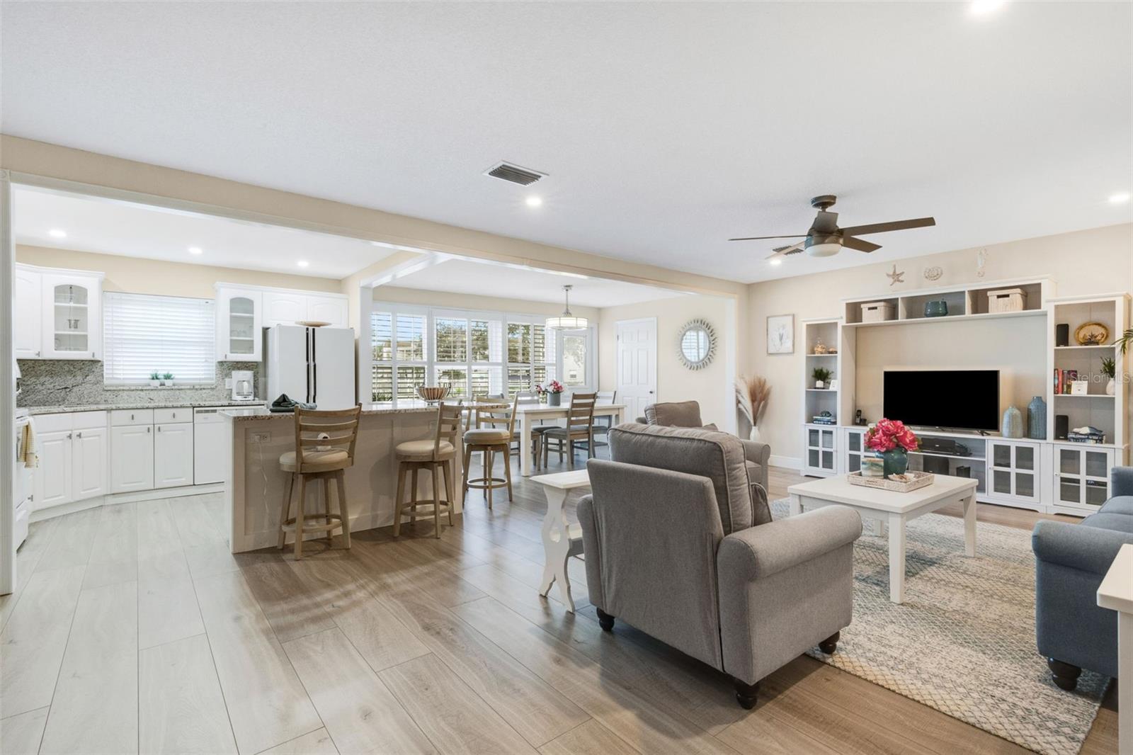 Updated and Remodeled - Great Room Plan Combining Island Kitchen, Living Room and Florida/Dining Room   with Aqua Guard Flooring Through the Unit