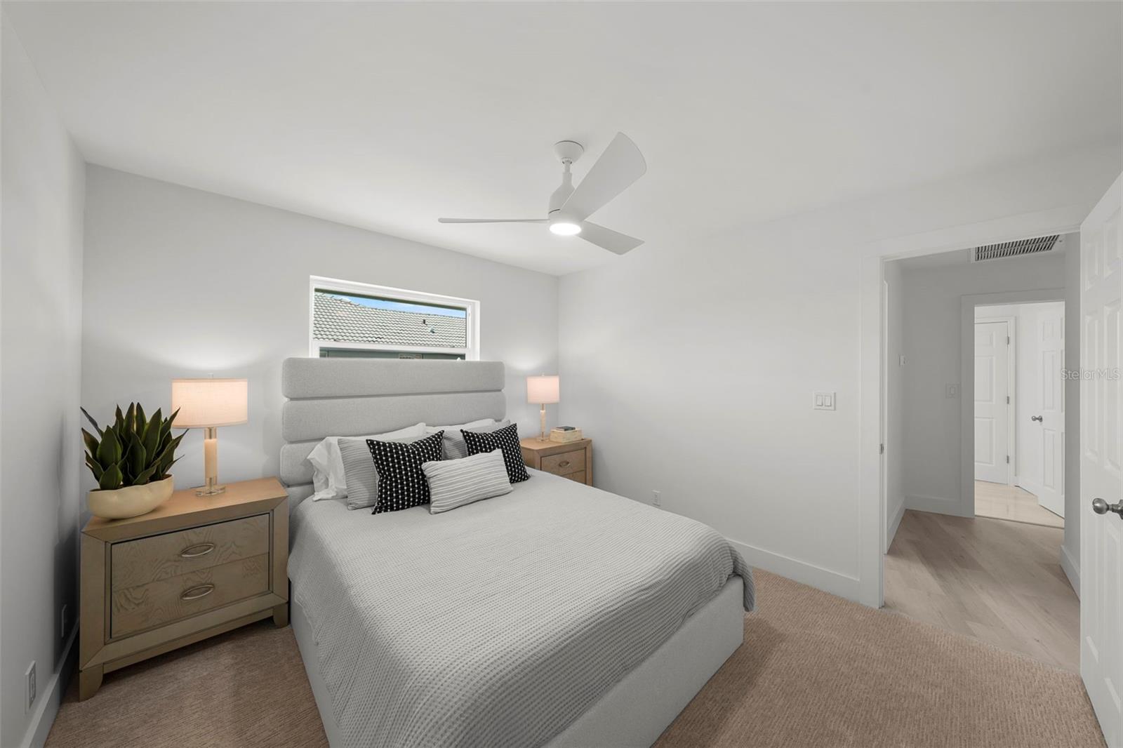 The 2nd bedroom is positioned in a separate nook, complete with an en-suite bath.