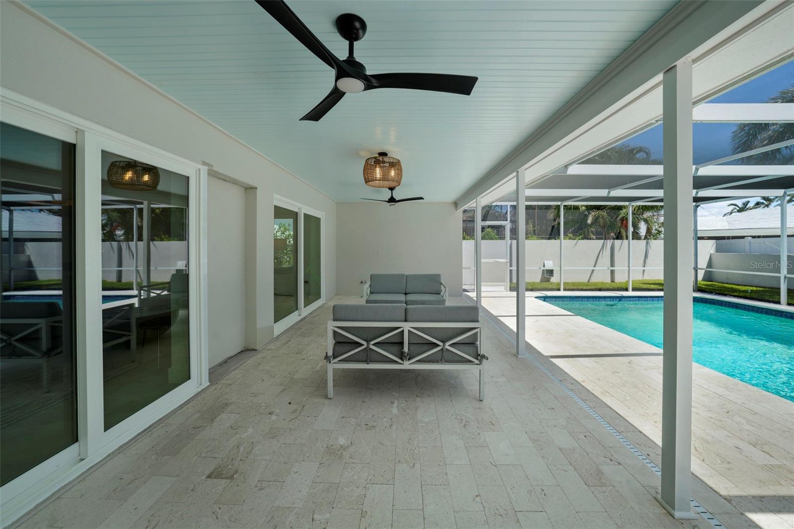 Plenty of room to unwind, dine, and entertain on this elegant pool deck