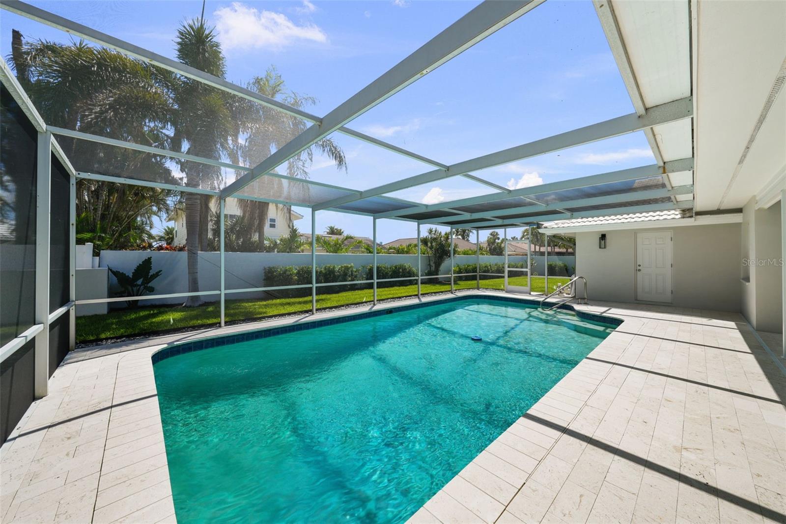 Your private screened-in pool awaits, designed for sunny Florida days and serene evenings.