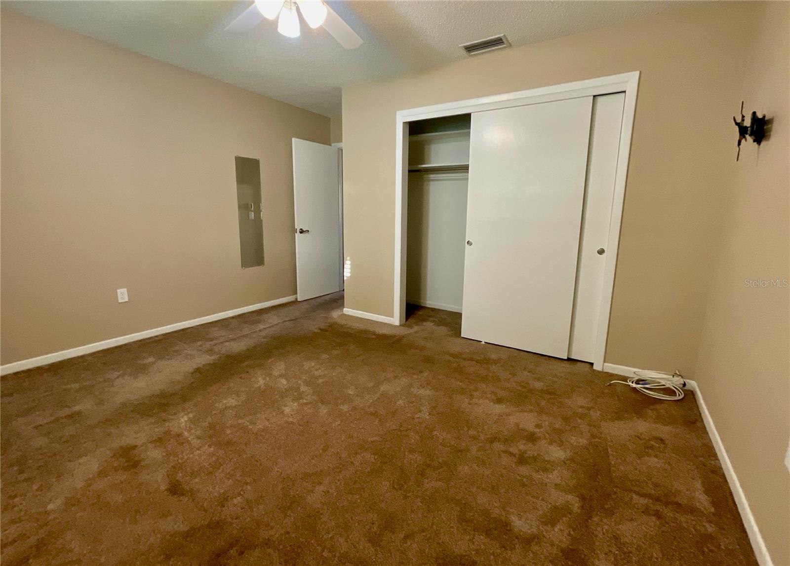 20-Primary bedroom closet and door to hall