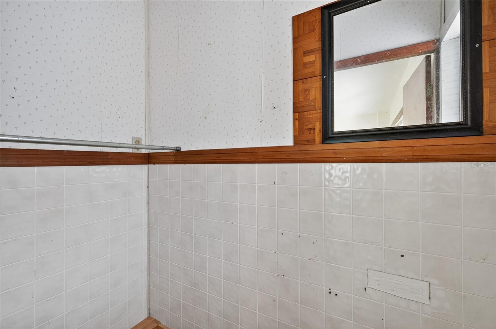 Unfinished 1/2 bath off the dining room.