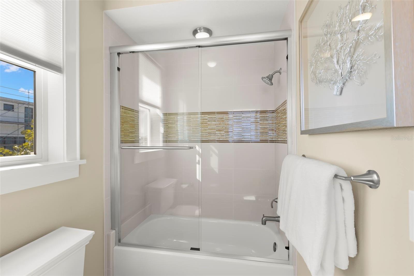 Soaking Tub and Glass Shower Enclosure in the Second Suite
