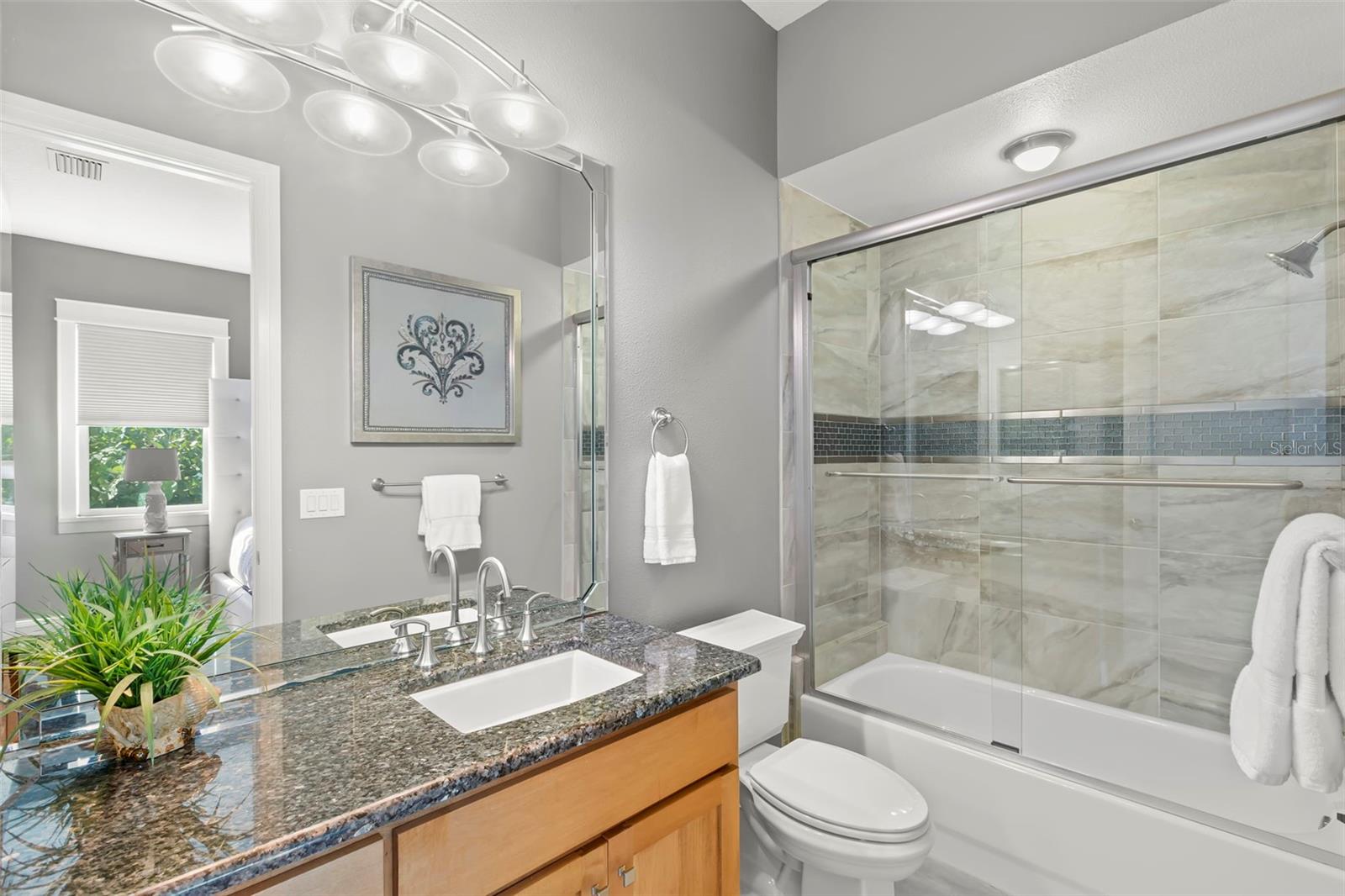 Third Ensuite Bath has a soaking tub and glass shower enclosure.