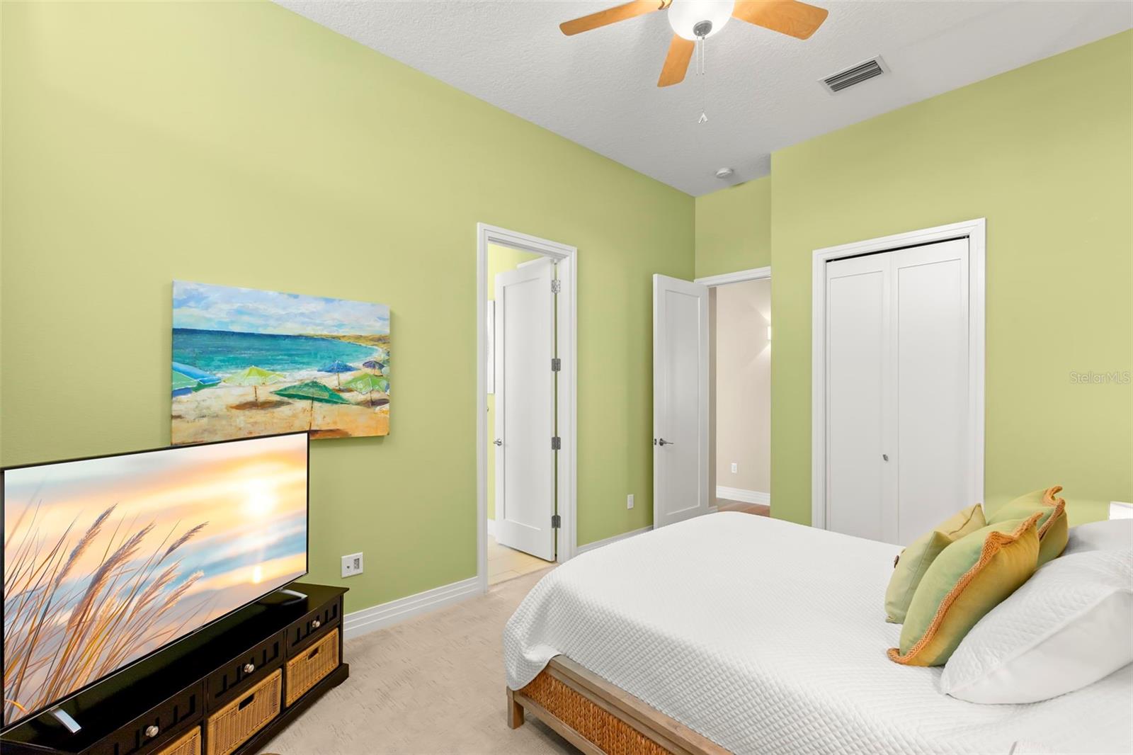 On the main living level, the Fourth Bedroom has doors to the