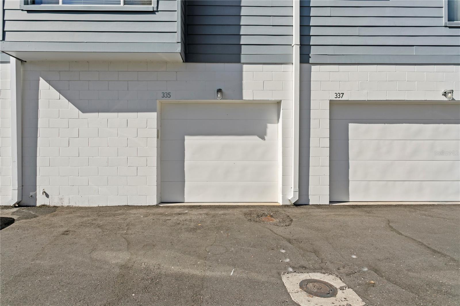 Exterior of unit private 1 car garage on east side of building