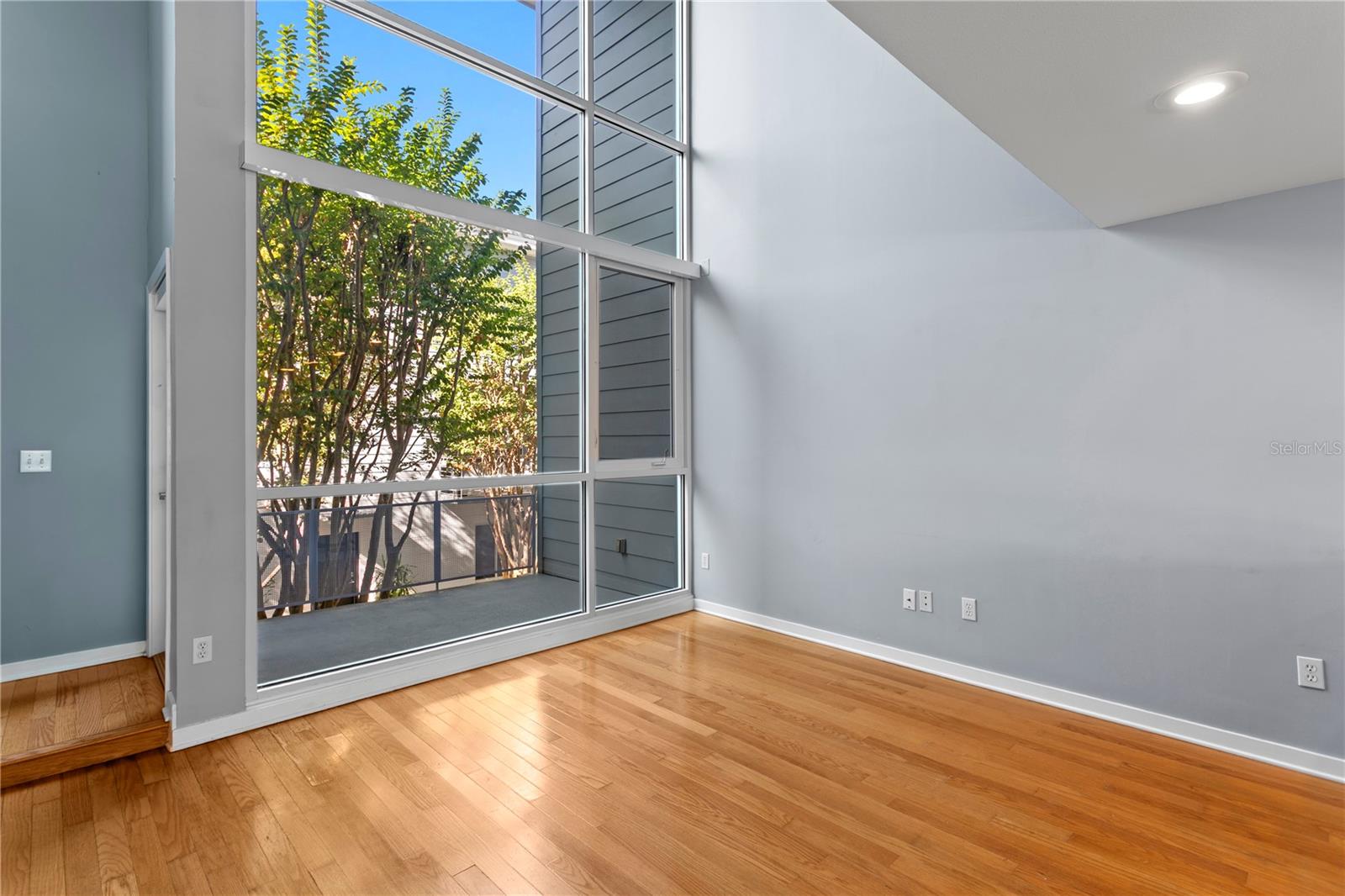 Abundance of natural light with the Floor to ceiling windows open to 2nd and 3rd levels with high ceilings