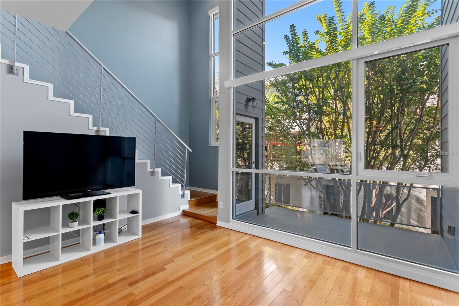 Main level (2nd) Living area to courtyard to stairs to Primary ensuite