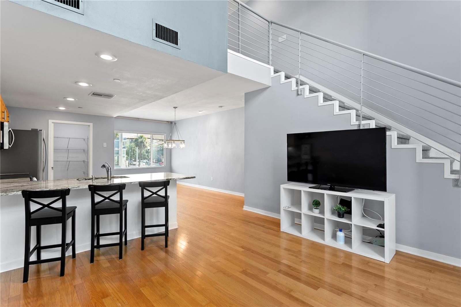Main level (2nd) looking back from Living room to spacious open concept floor plan