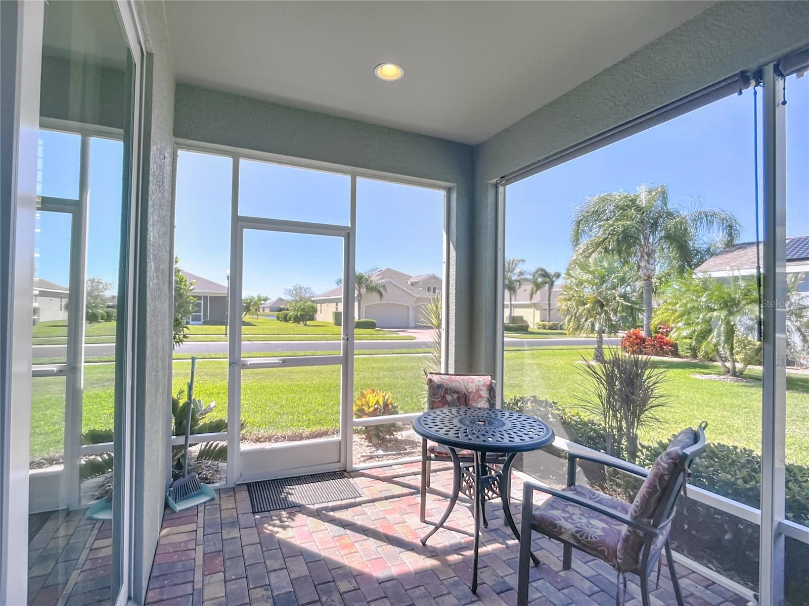 Screen lanai takes advantage of views for the corner lot