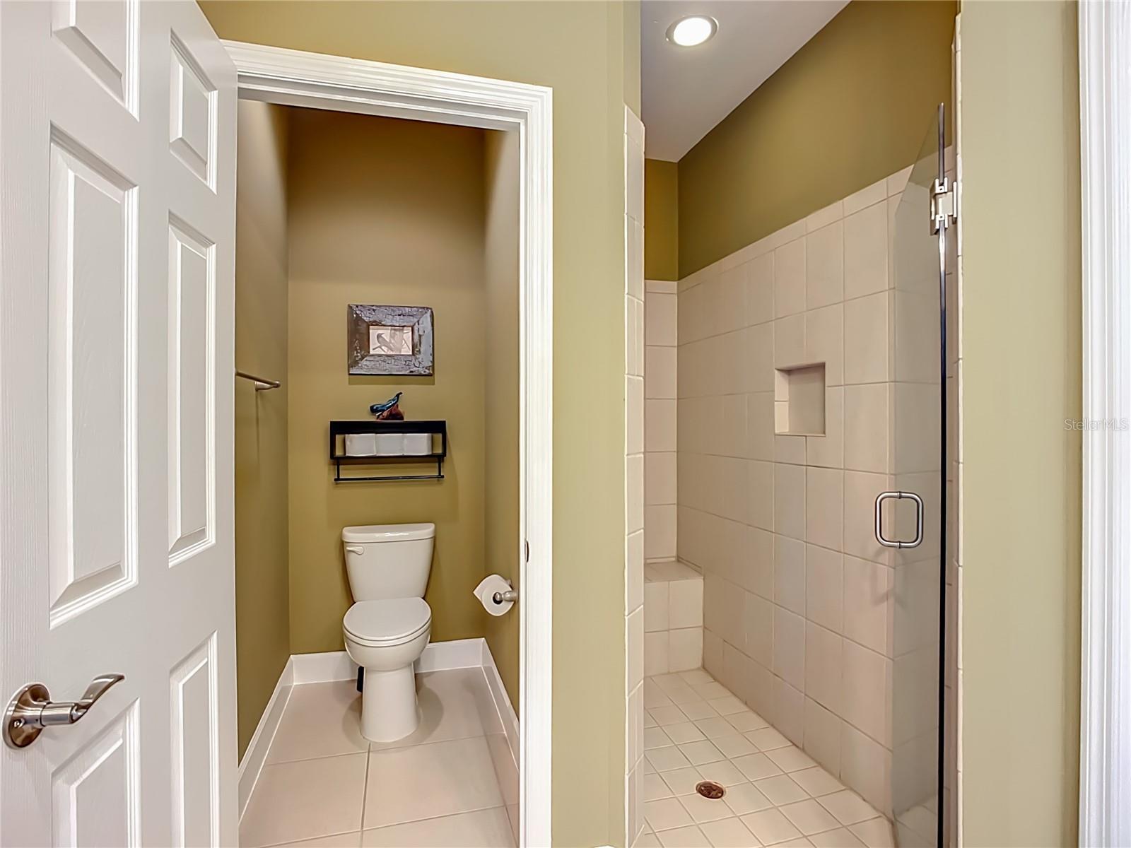 Water closet, walk-in shower with built-in seat