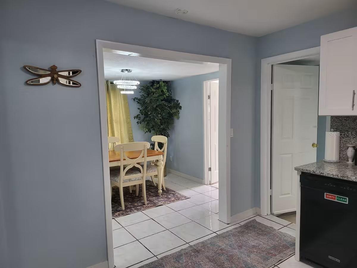 Kitchen into Dining Room (Left) and Primary Bedroom (Right)