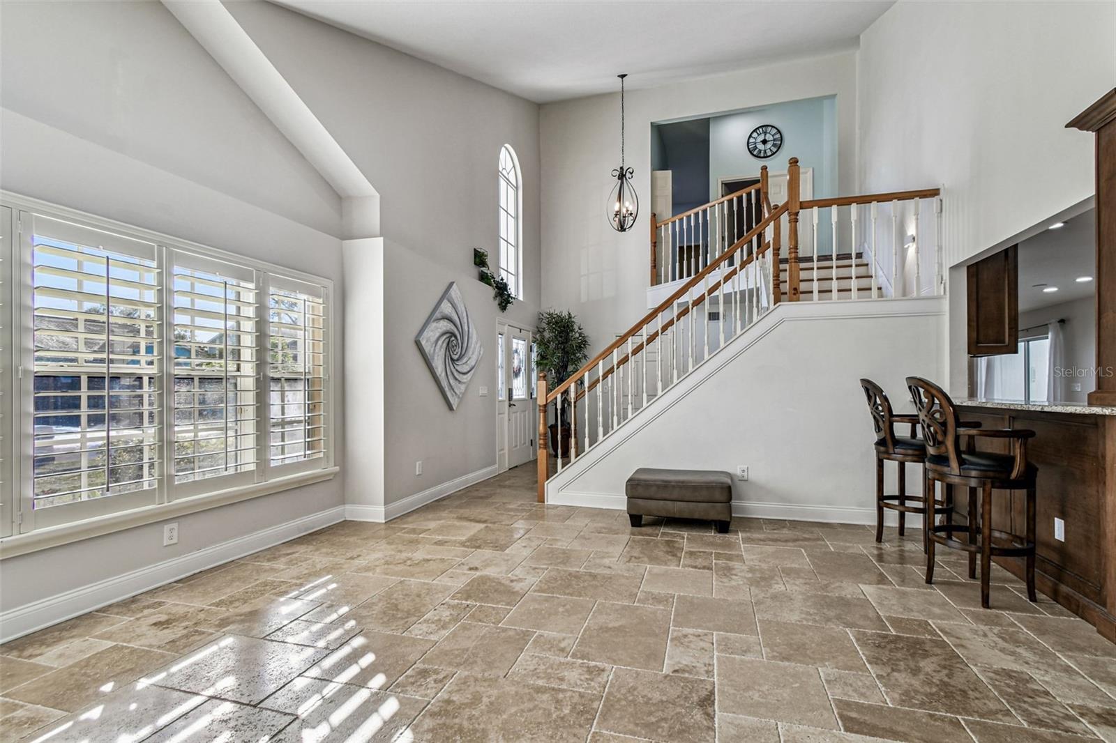 Large Window with wooden shutters in living room