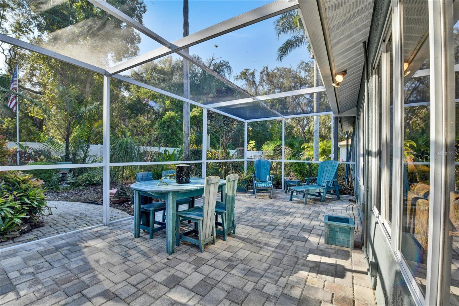 Enclosed Screened area opening to the large backyard.