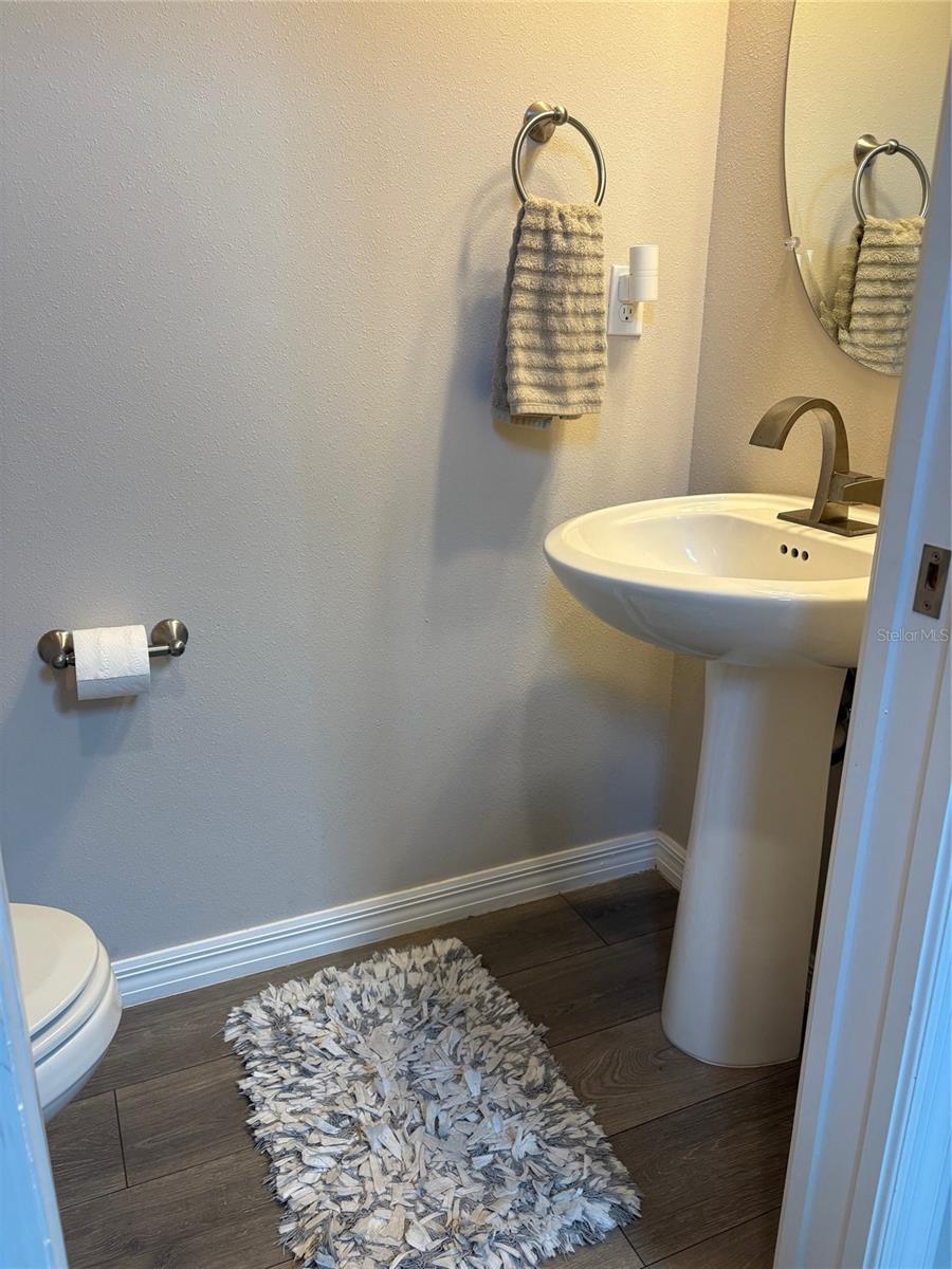 Half bath at bottom of stairs