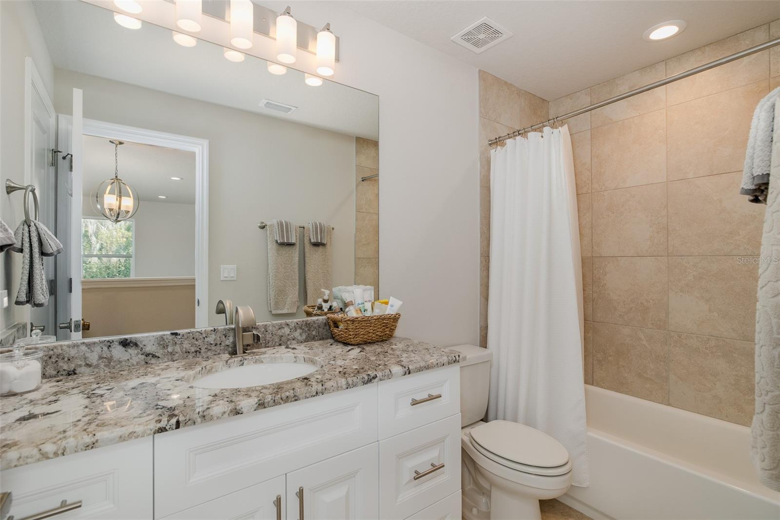 Large second floor bathroom with tub and shower