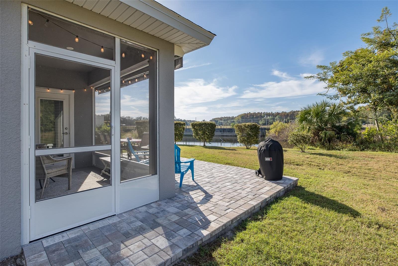 Screen door goes to walkway to patio