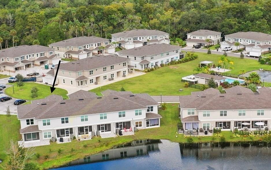 Home is an end unit with lots of space and ponds on two sides