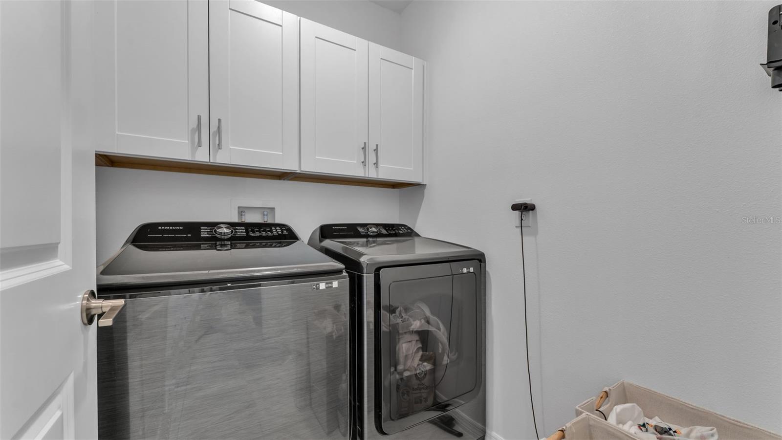 laundry room with storage