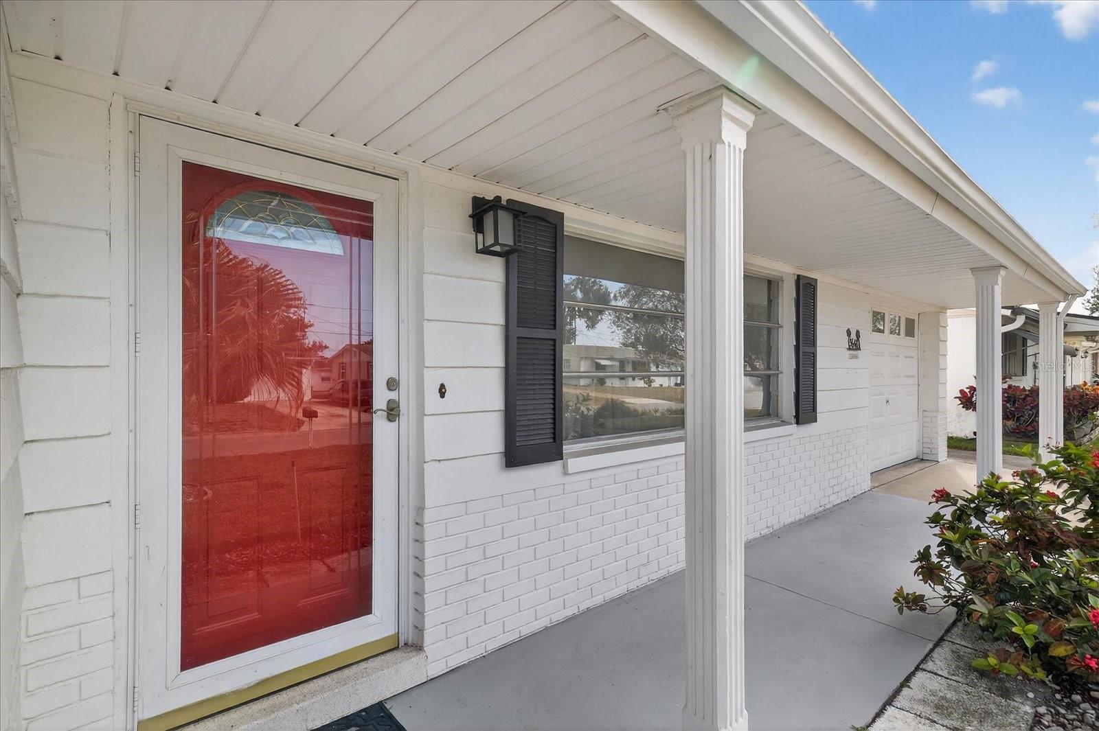 Welcoming Front entry door with storm door