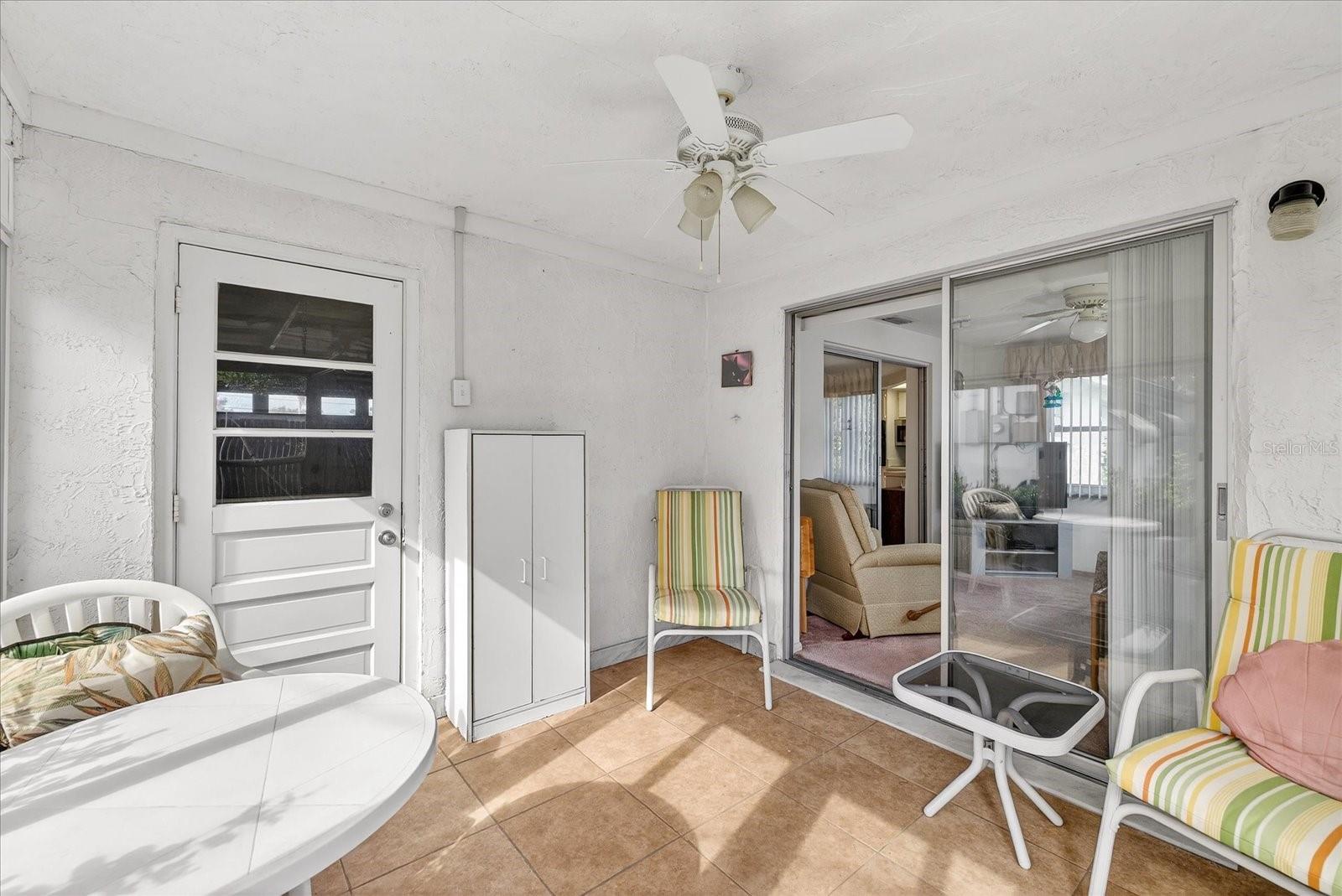 Florida room with door to family room and garage.