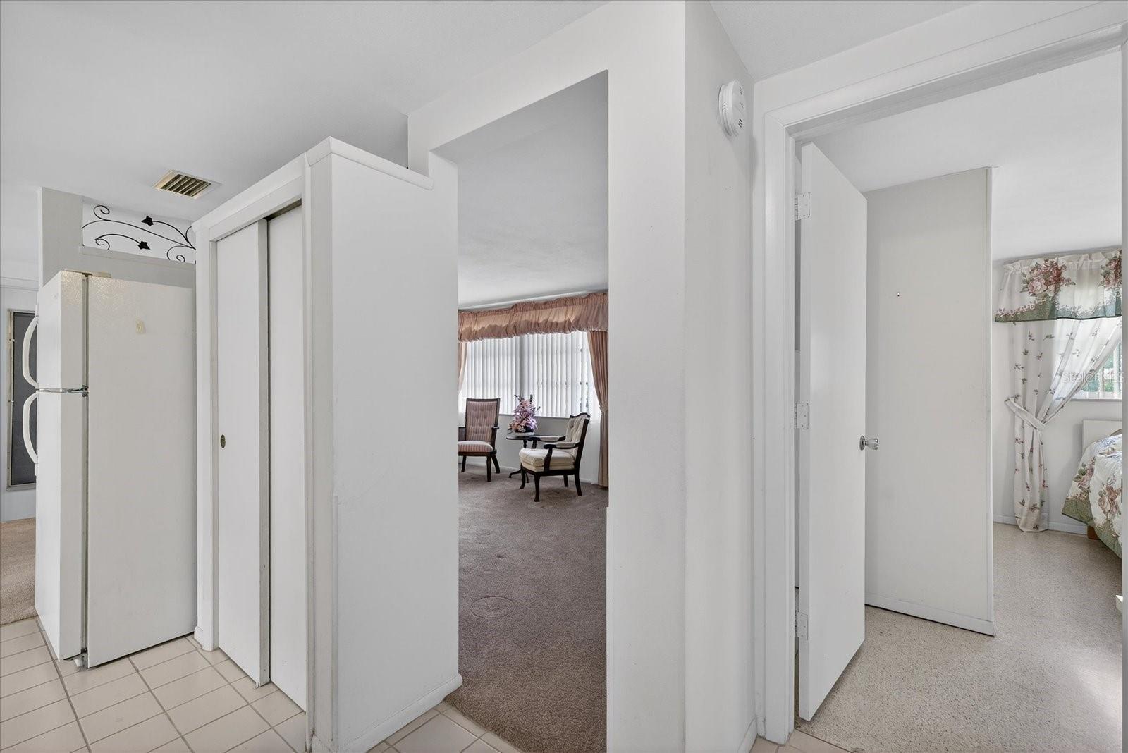 Kitchen pantry/doorway to living room and doorway to Primary bedroom