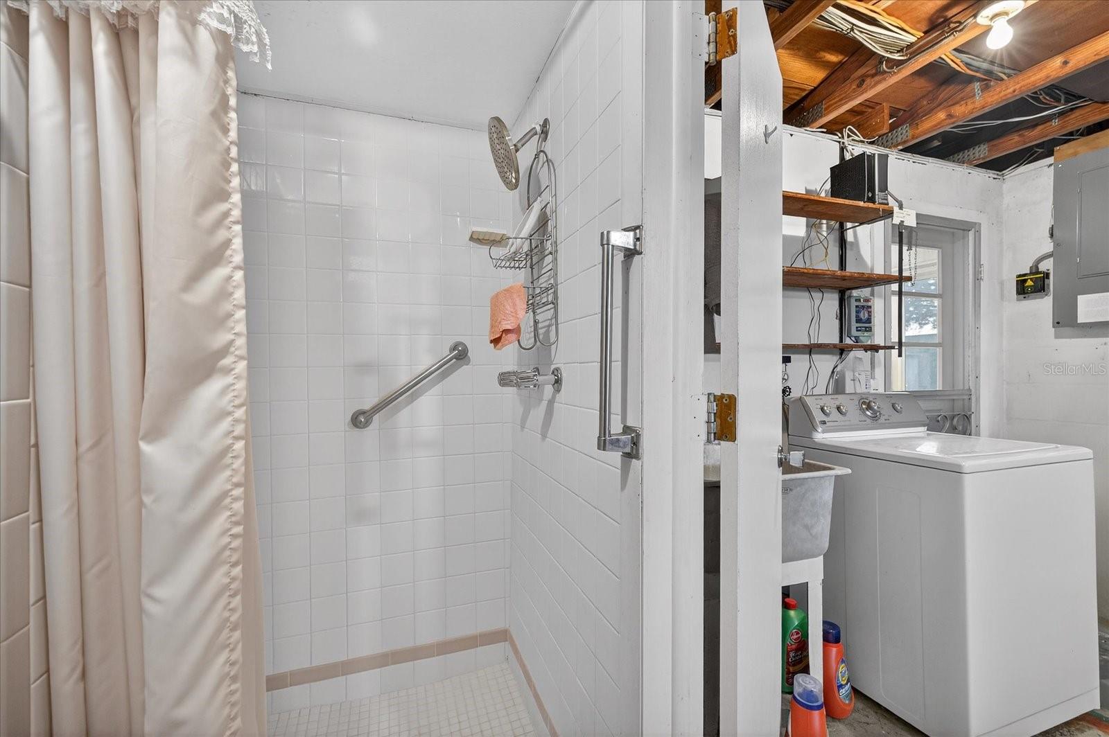 2nd bathroom in garage with shower/toilet/laundry sink