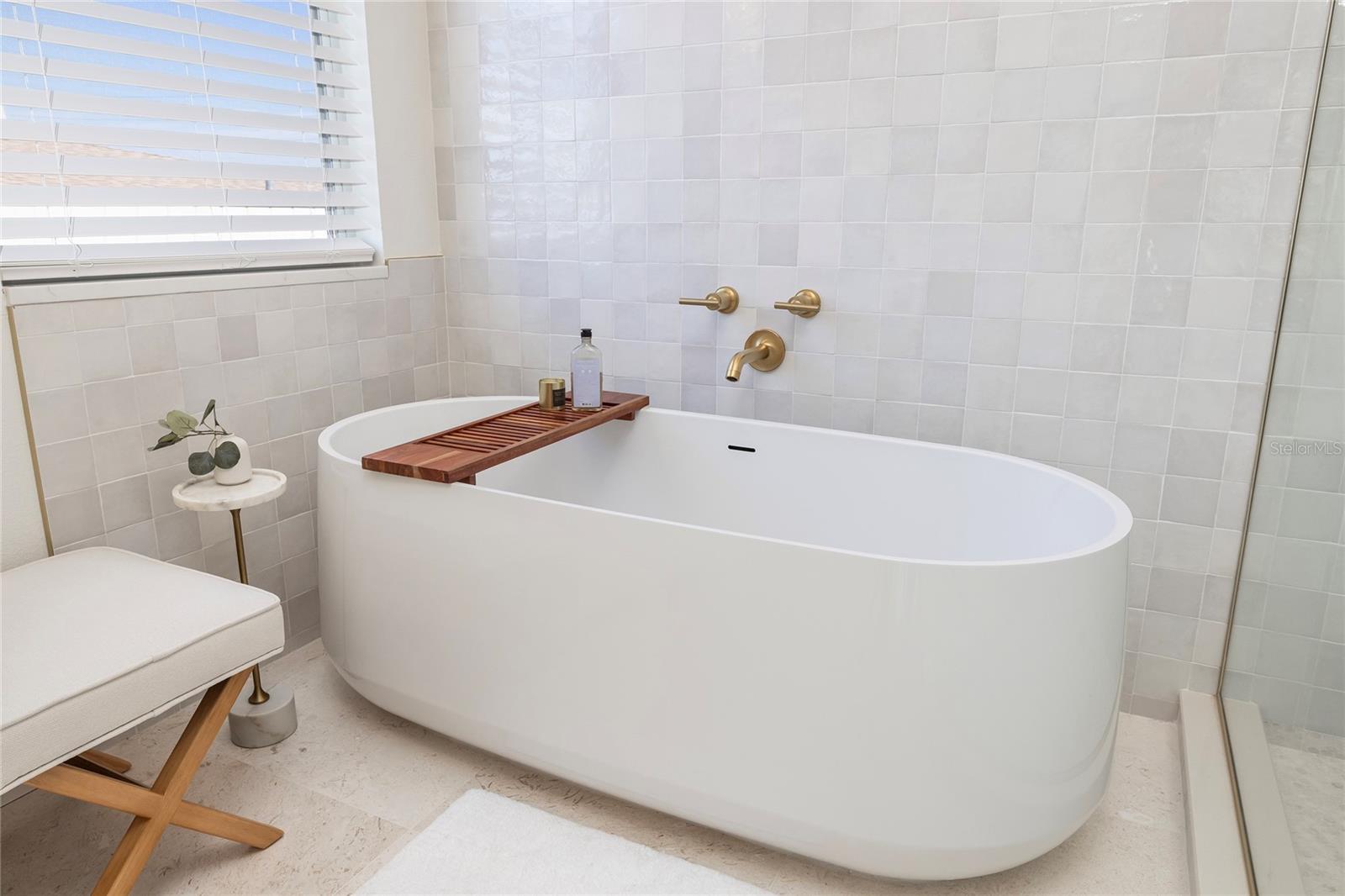 Primary Bathroom with a large, freestanding soaking tub