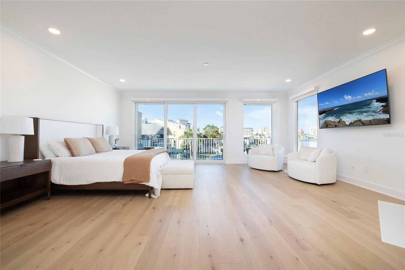 Primary Bedroom -- Sliders leading to balcony overlooking the Intracoastal Waterway