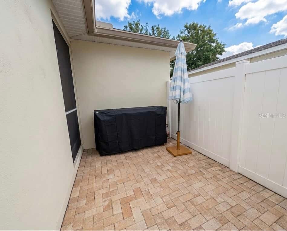 Additional exterior patio area with grill