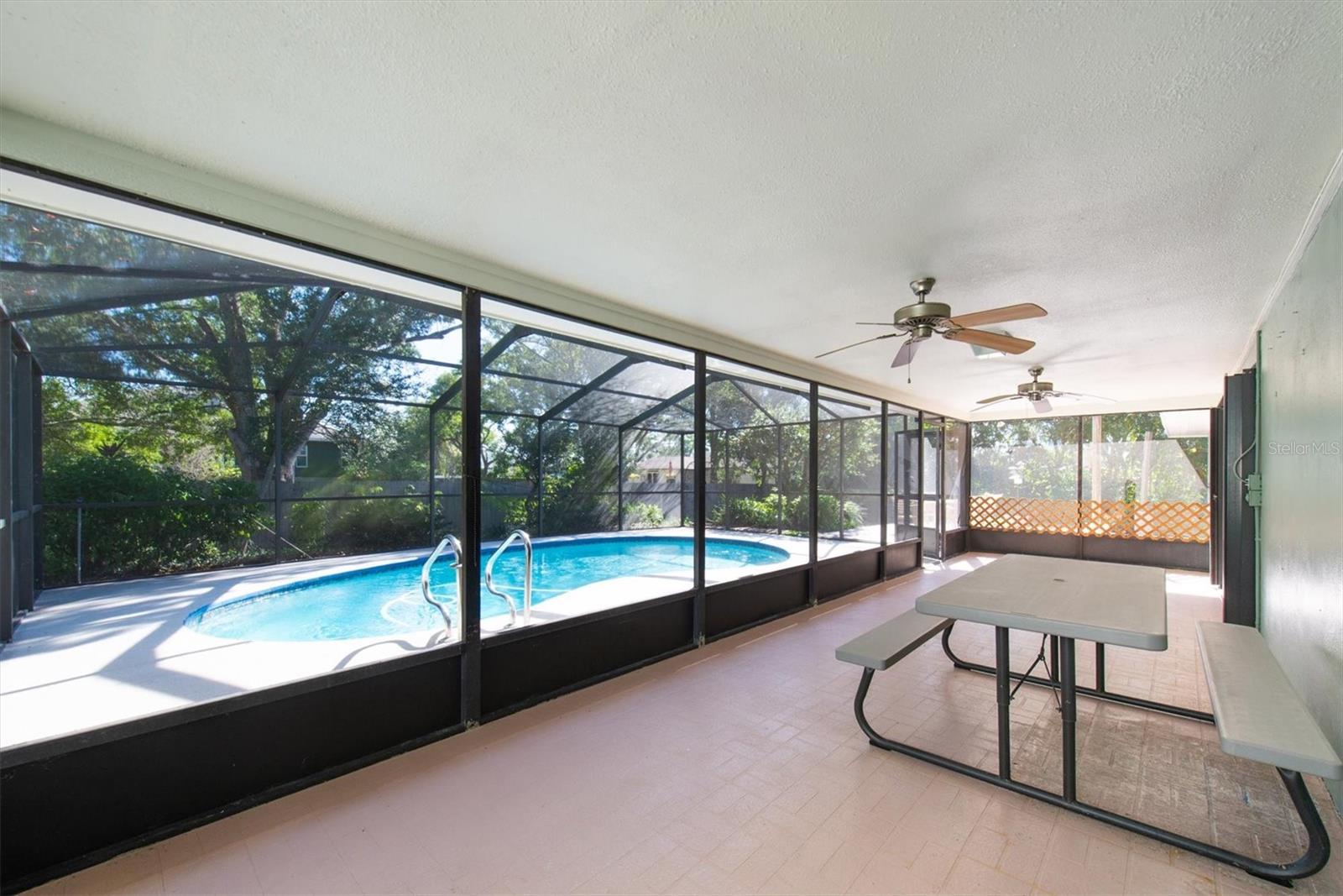 Large screened patio overlooking the pool