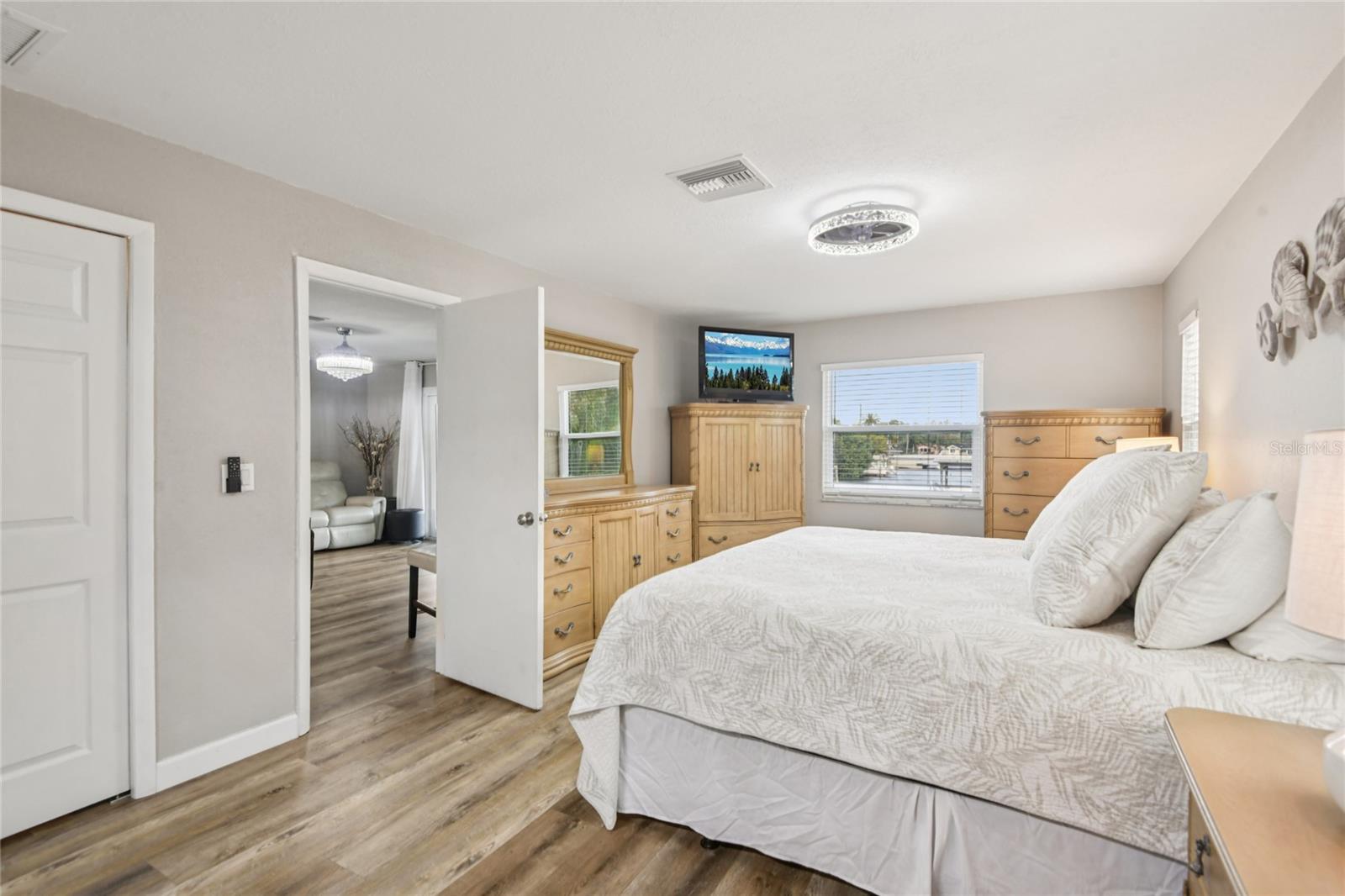 Primary bedroom with views of the water