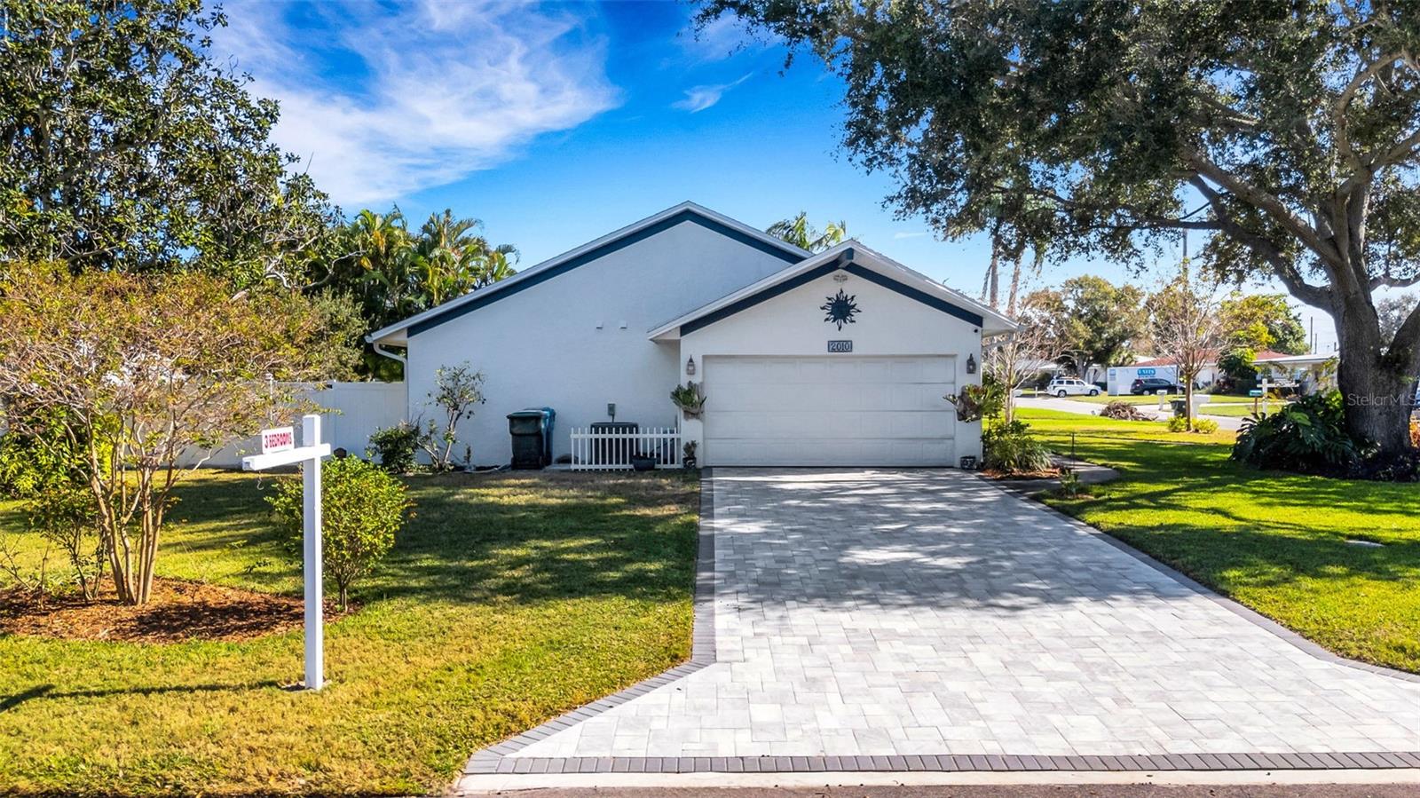 2 car garage with paver driveway