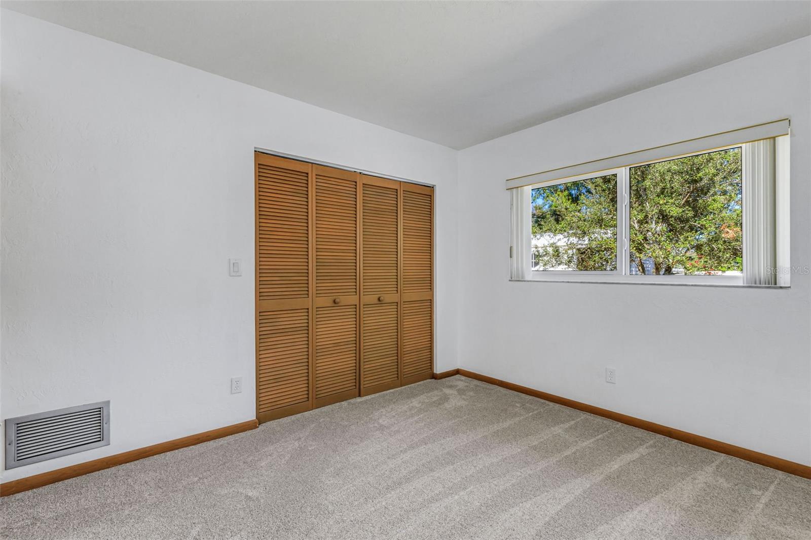 bedroom 3 overlooks backyard