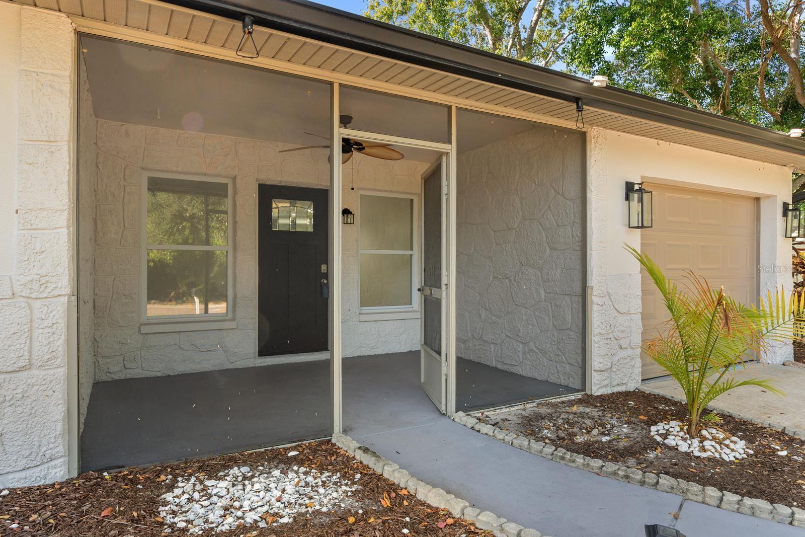 Screen enclosed covered front porch