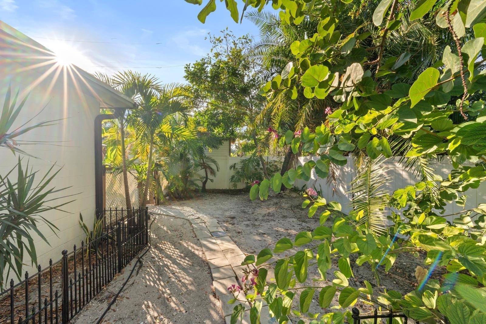 Separate fenced side yard, perfect for garden or dog run