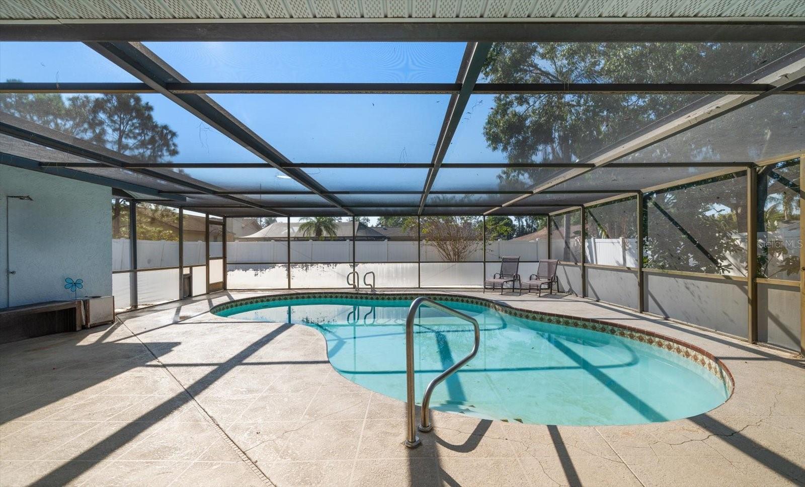 Pool with screen enclosure