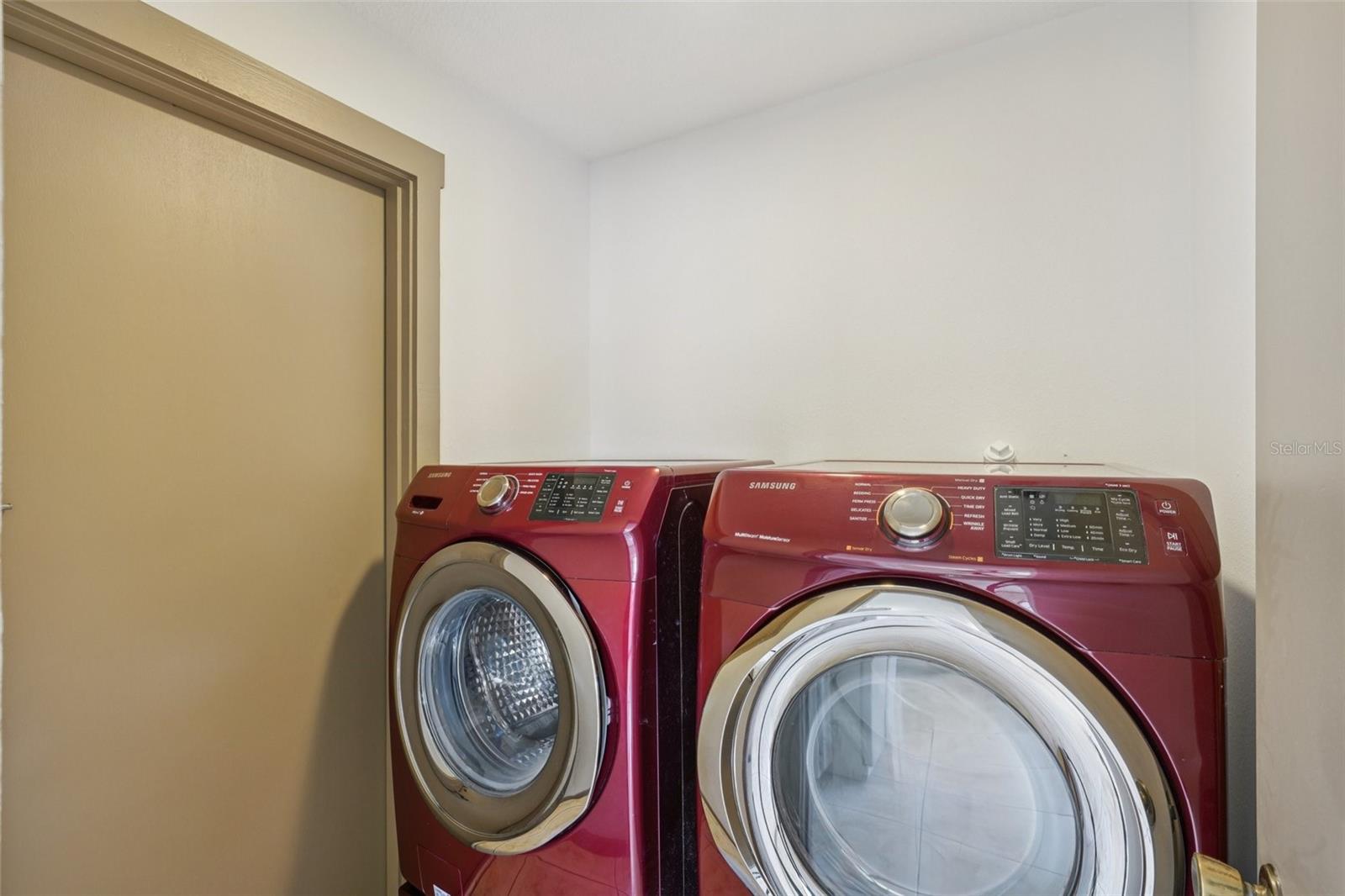 Utility room off kitchen with convenient garage entry